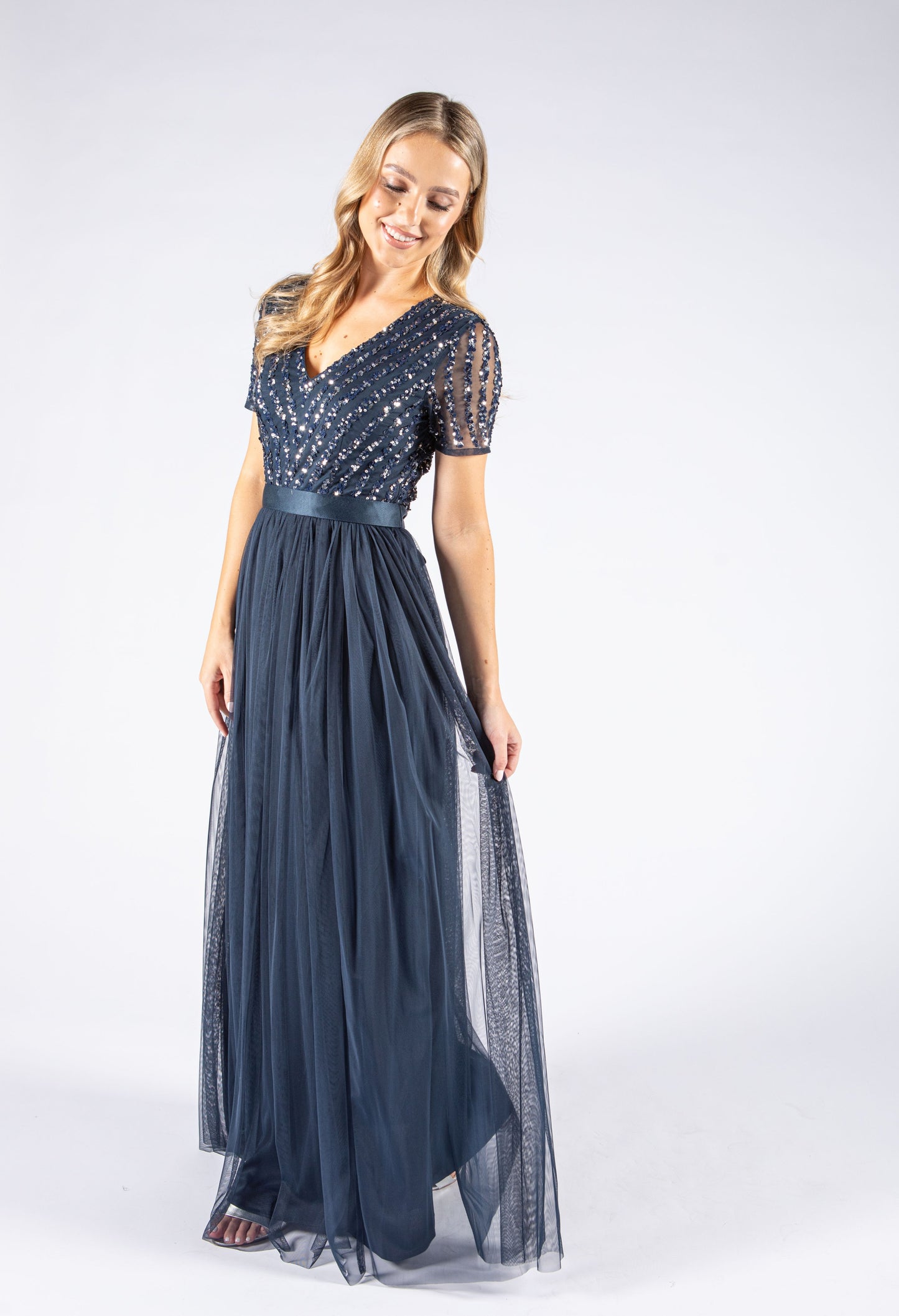 NAVY V NECK SEQUIN AND TULLE DRESS WITH TIE WAIST