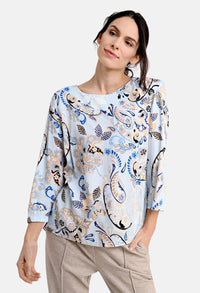 Blouse with ornament print